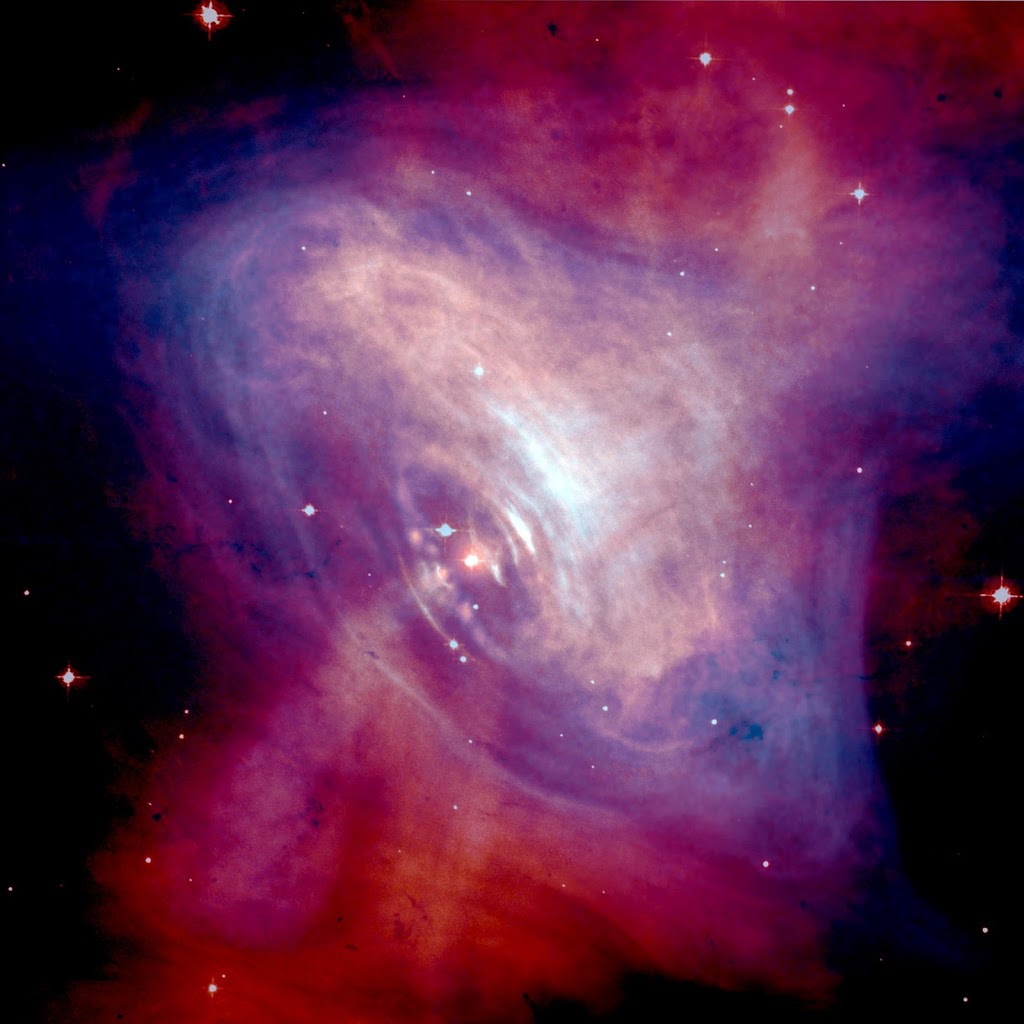 A composite image of the Crab Nebula showing the X-ray (blue), and optical (red) images superimposed.