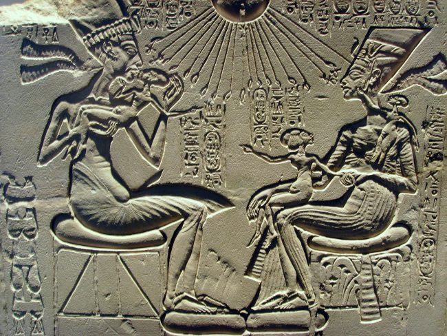 A "house altar" (c. 1350 BC) depicting Akhenaten, Nefertiti and three of their daughters. Note Nefertiti wears a crown similar to that depicted on the bust.