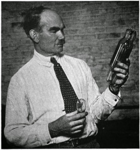 Lee De Forest (1873-1961) with two of his tubes