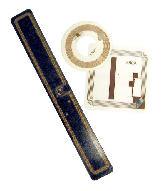 RFID tags used in libraries: square book tag, round CD/DVD tag and rectangular VHS tag