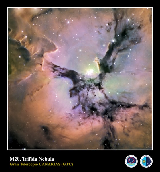 The Trifid Nebula (M20) is an H II region located in Sagittarius. Its name means 'divided into three lobes'. The object is an unusual combination of an open cluster of stars, an emission nebula (the lower, red portion), a reflection nebula (the upper, blue portion) and a dark nebula (the apparent 'gaps' within the emission nebula that cause the trifid appearance).