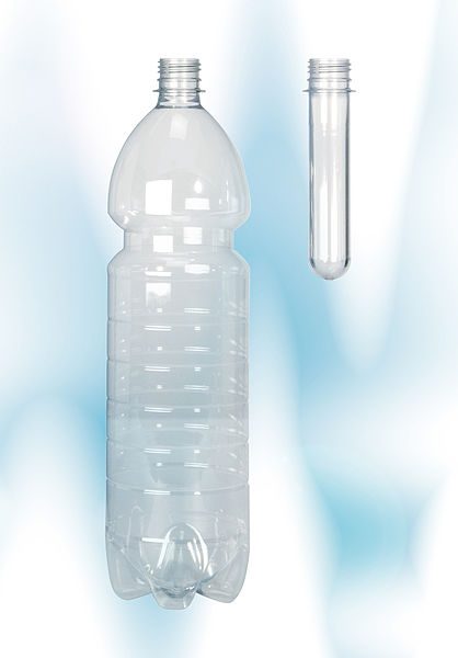 A finished PET drink bottle compared to the preform from which it is made.