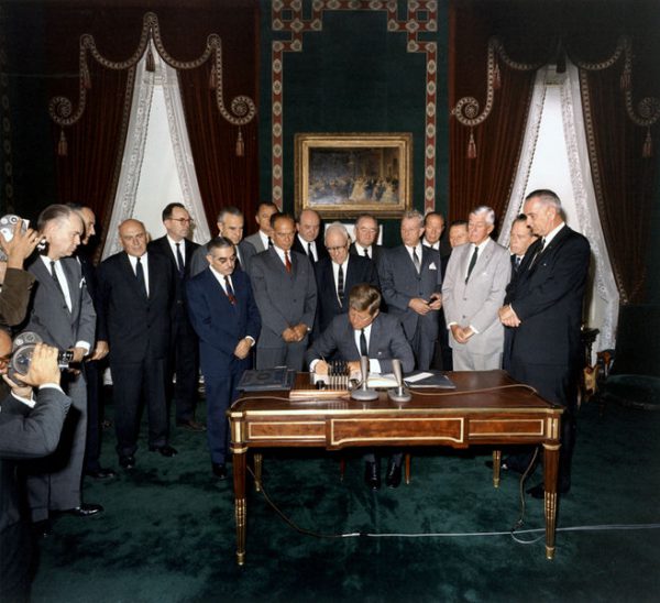 Kennedy signs the Partial Nuclear Test Ban Treaty on 7 October 1963