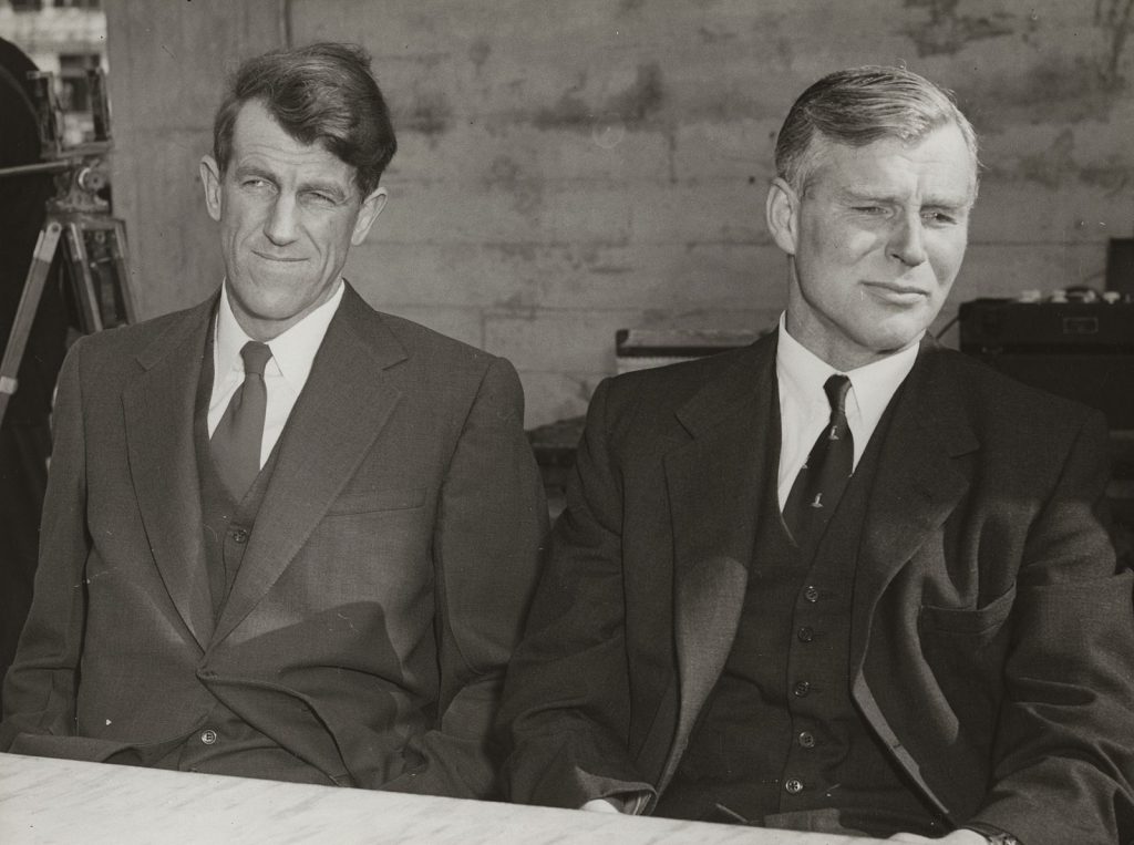 Sir Edmund Hillary and Sir Vivian Fuchs during a press conference on a Wellington wharf, 1958
