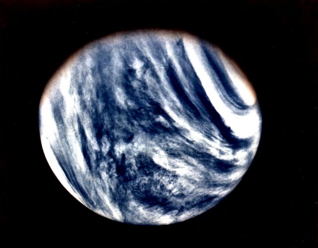 Mariner 10's photograph of Venus in ultraviolet light (photo color-enhanced to simulate Venus's natural color as the human eye would see it)
