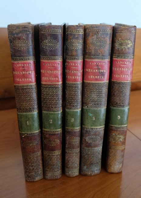 Volumes 1-5 of Pierre-Simon Laplace's "Traité de mécanique céleste" (1799) [Public Domain] via WIkiCommons
