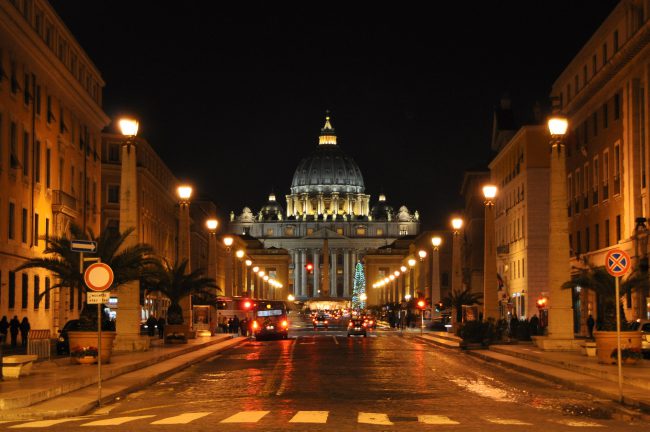 St. Peter's Basilica at night from Via della Conciliazione in Rome.
