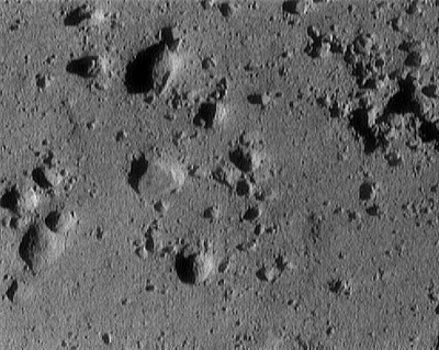 Eros asteroid from approximately 250 meters altitude (area in image is roughly 12 meters across [1]). This image was taken during NEAR's descent to the surface of the asteroid.