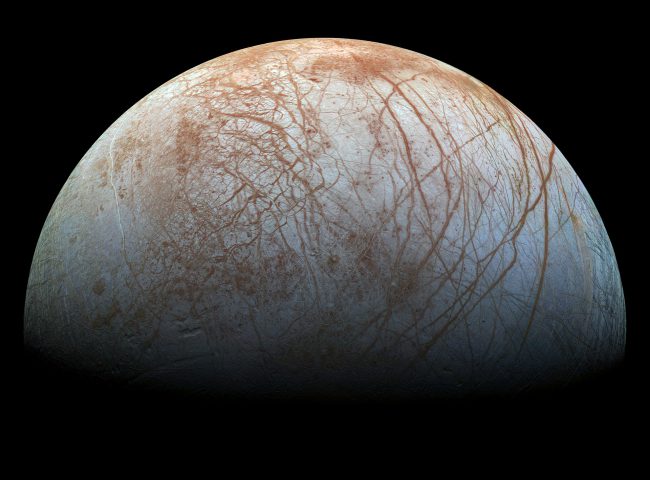 The puzzling, fascinating surface of Jupiter's icy moon Europa looms large in this newly-reprocessed color view, made from images taken by NASA's Galileo spacecraft